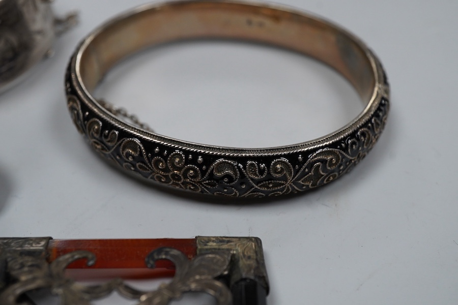 A group of silver jewels, comprising: a Scottish hardstone brooch of square outline; a pair of Arts and Crafts citrine and green tourmaline ear clips, length 2.7cm each; a silver link bracelet; a silver filigree bracelet